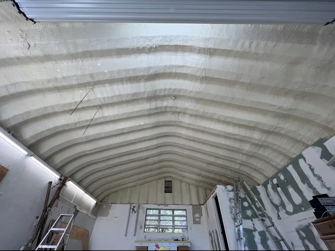 Spray polyurethane foam applied to the underside of a metal roof deck in Lower Saucon